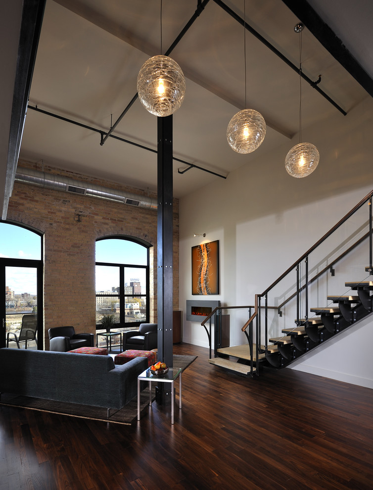 Photo of a modern living room in Minneapolis with white walls and a ribbon fireplace.