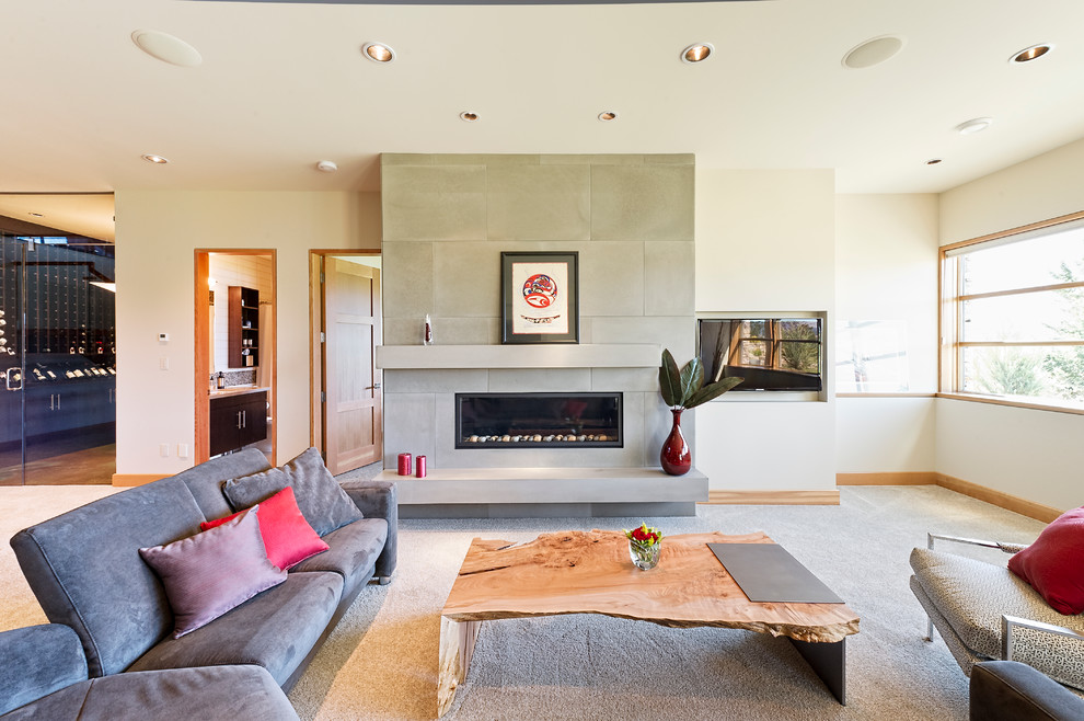 Design ideas for a contemporary living room in Calgary with a tiled fireplace surround.