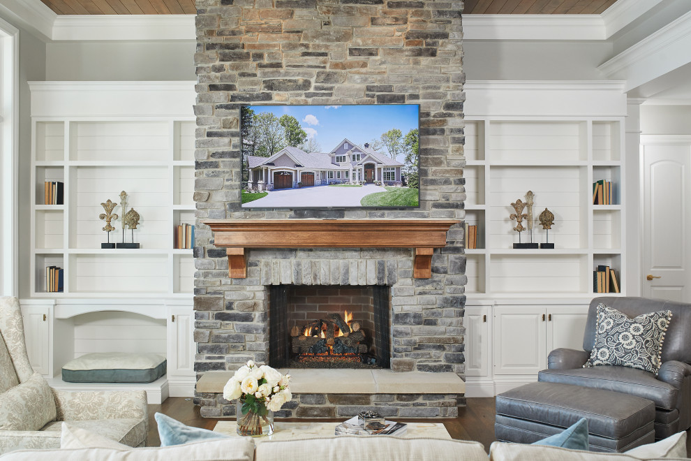 Inspiration for a coastal open plan living room in Grand Rapids with grey walls, medium hardwood flooring, a standard fireplace, a stone fireplace surround, a wall mounted tv, brown floors and a timber clad ceiling.