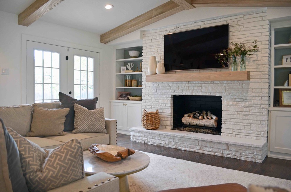 Transitional open concept medium tone wood floor living room photo in Dallas with white walls, a standard fireplace and a brick fireplace