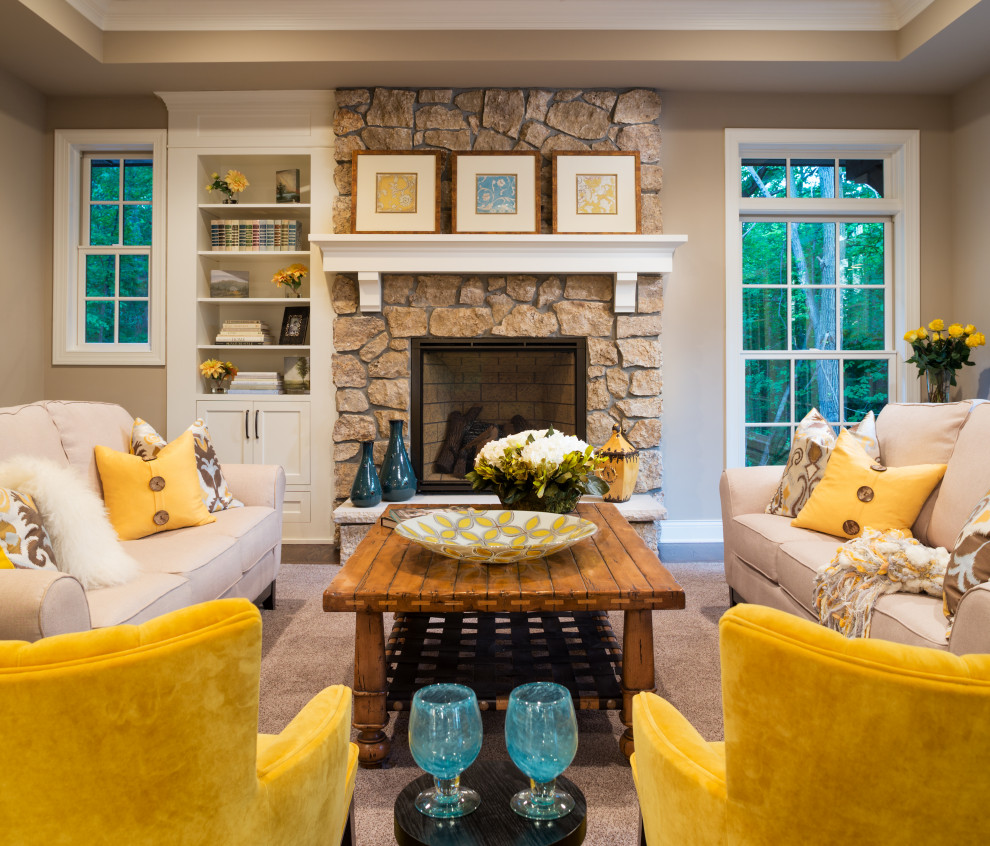 This is an example of a traditional formal and grey and yellow enclosed living room in Minneapolis with beige walls, dark hardwood flooring, a standard fireplace, a stone fireplace surround, no tv and brown floors.