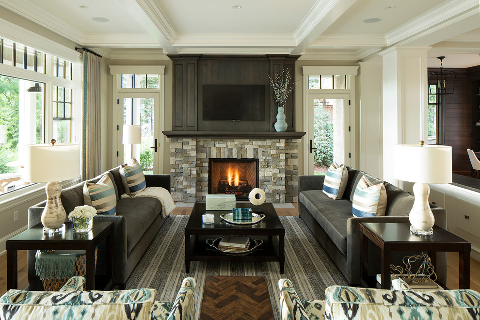 Design ideas for a large open plan living room in Minneapolis with beige walls, medium hardwood flooring, a standard fireplace, a stone fireplace surround and a wall mounted tv.