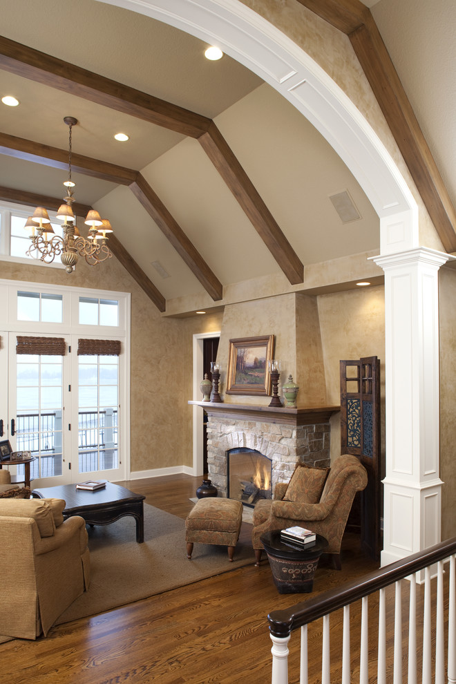 Classic living room in Minneapolis with a stone fireplace surround.