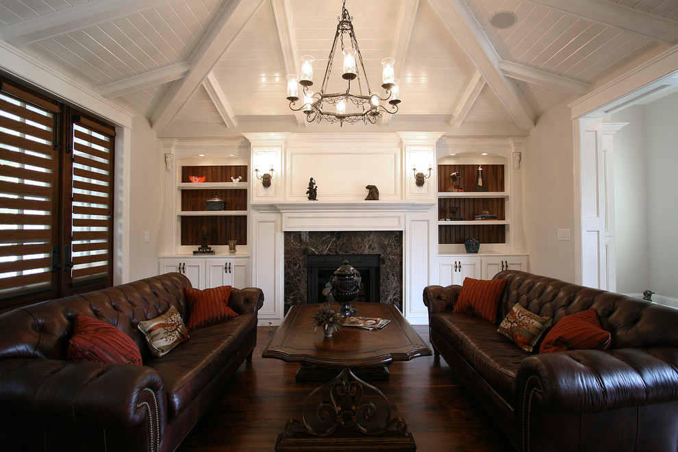 Photo of a classic enclosed living room in Charlotte with white walls and a standard fireplace.