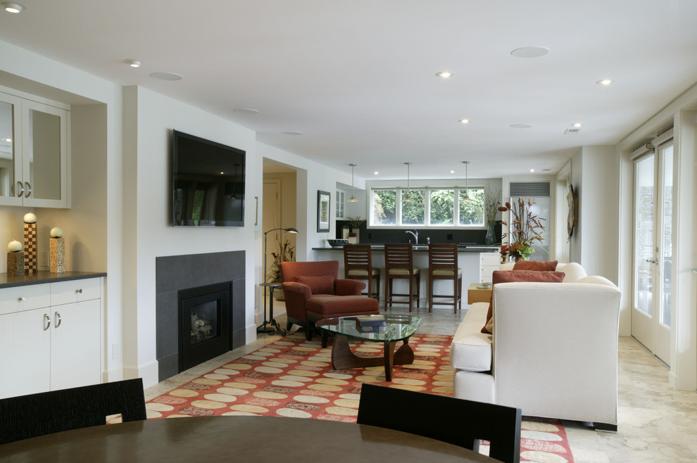 Идея дизайна: парадная, открытая гостиная комната среднего размера в стиле модернизм с белыми стенами, бетонным полом, стандартным камином, фасадом камина из камня и телевизором на стене
