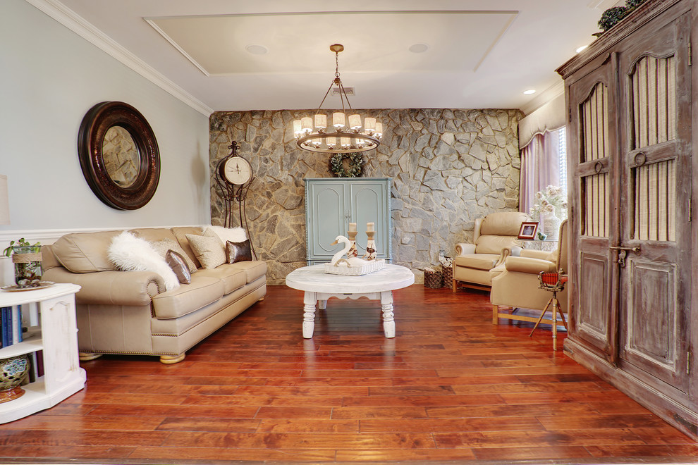 This is an example of a medium sized traditional formal enclosed living room in New York with grey walls, medium hardwood flooring and brown floors.