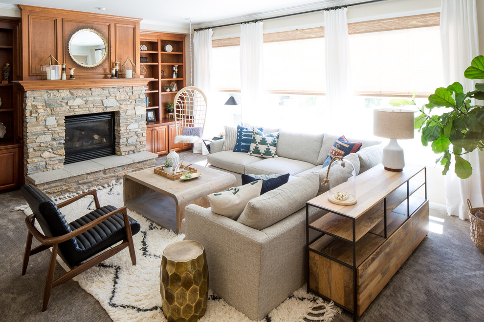 This is an example of a coastal living room in Seattle with carpet, a standard fireplace, no tv and beige walls.