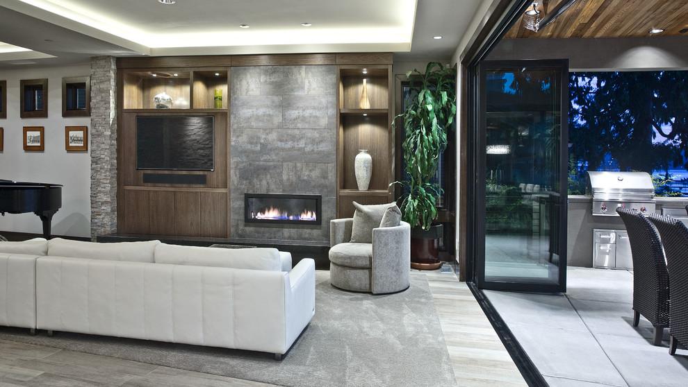 Design ideas for a medium sized contemporary formal open plan living room in Seattle with grey walls, medium hardwood flooring, a ribbon fireplace, a concrete fireplace surround, a wall mounted tv and grey floors.