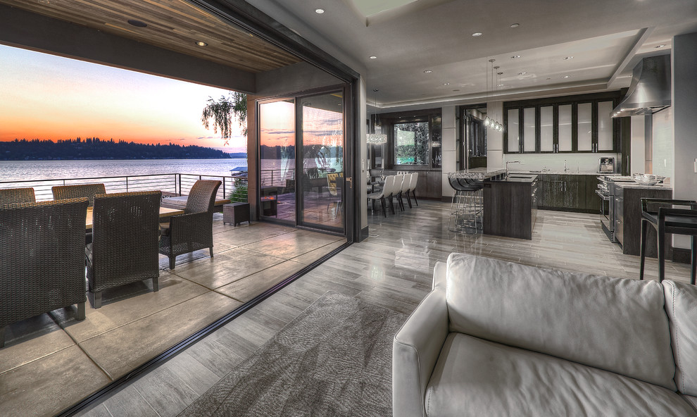 Medium sized contemporary formal open plan living room in Seattle with grey walls, medium hardwood flooring, no tv and grey floors.