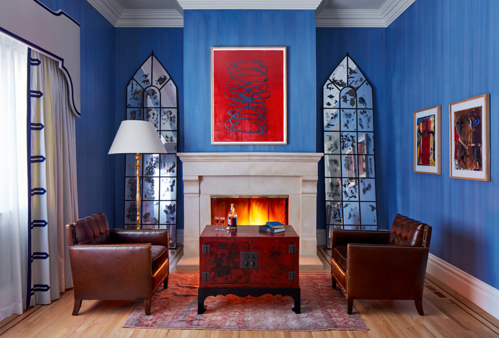 На фото: парадная, изолированная гостиная комната среднего размера в стиле неоклассика (современная классика) с синими стенами, светлым паркетным полом, стандартным камином, фасадом камина из плитки, серым полом и ковром на полу без телевизора