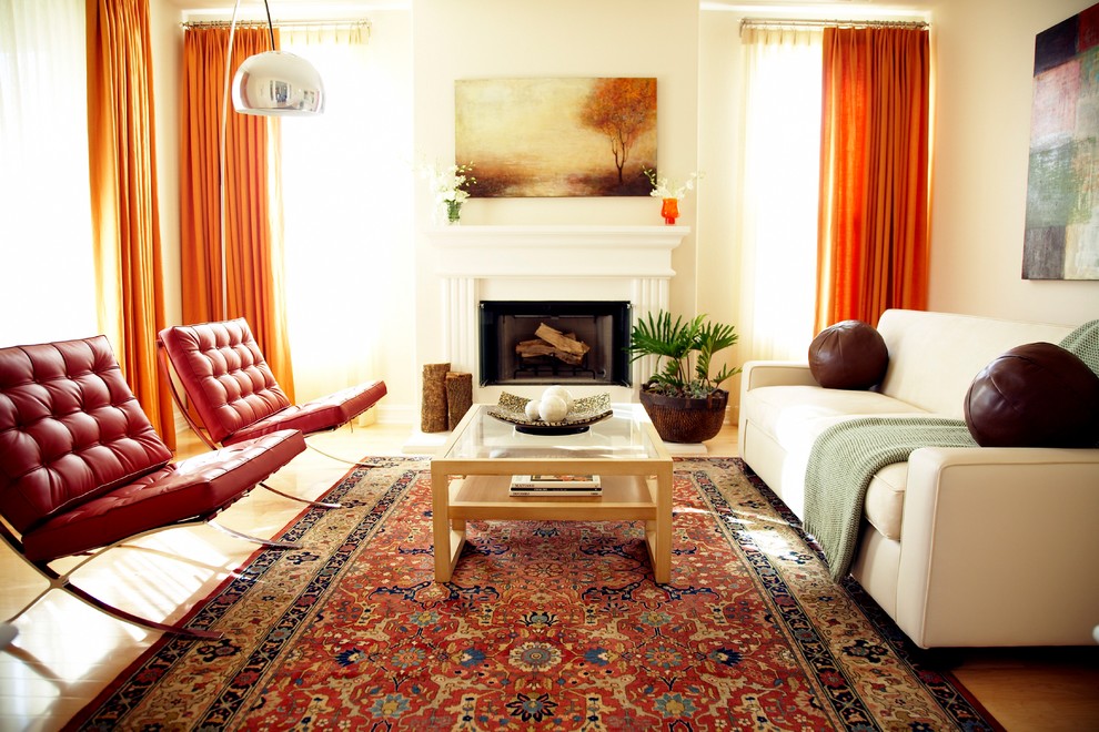 Example of a trendy living room design in Los Angeles with beige walls, a standard fireplace and no tv