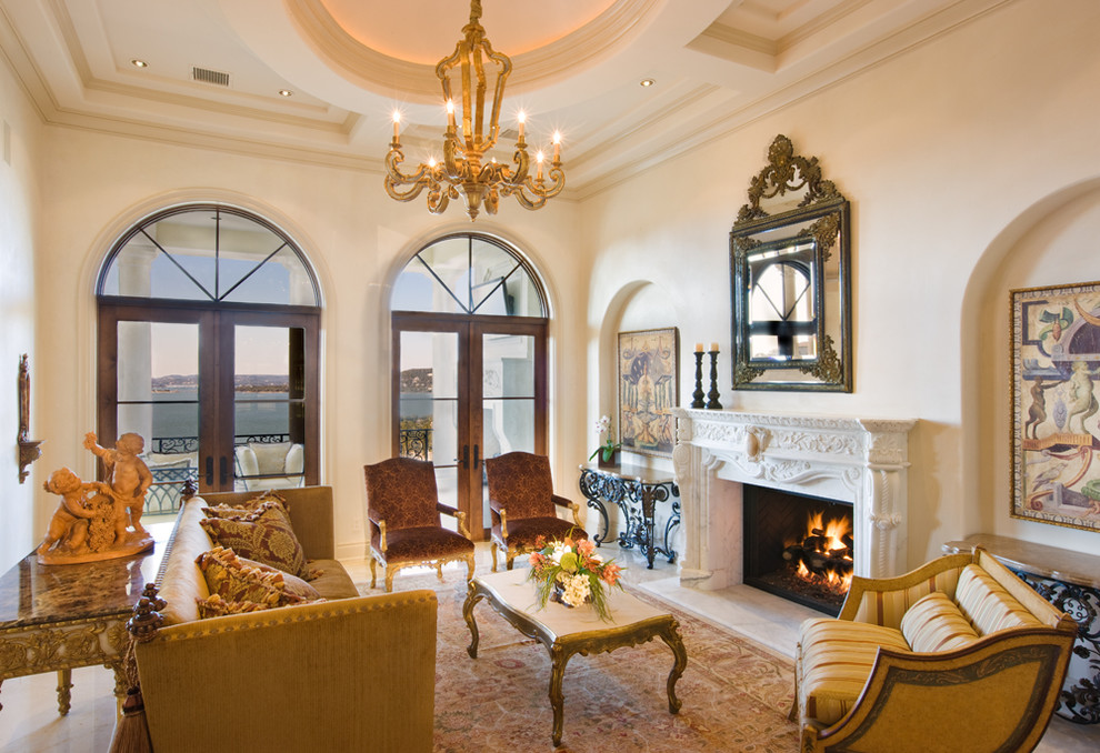 Design ideas for a large mediterranean formal enclosed living room in Austin with a standard fireplace, beige walls, a plastered fireplace surround and no tv.