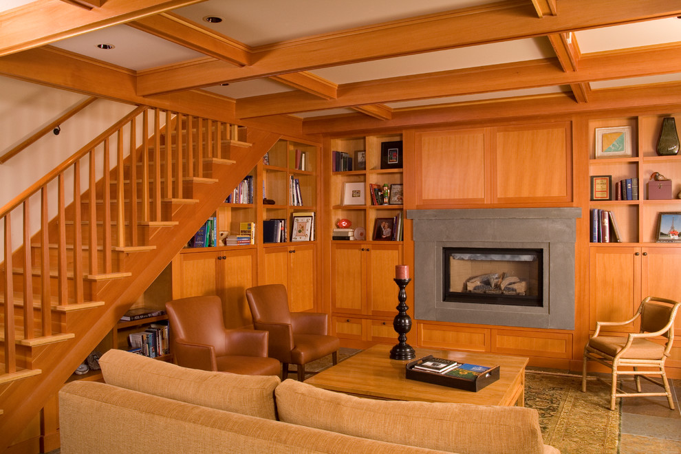 Photo of a traditional living room in Seattle with a concrete fireplace surround.