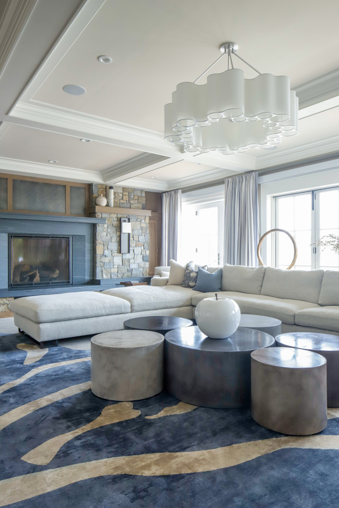 This is an example of a medium sized traditional formal enclosed living room in New York with beige walls, medium hardwood flooring, a standard fireplace, no tv and brown floors.