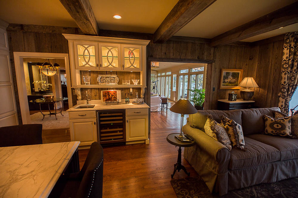 Medium sized rustic open plan living room in Other with a home bar, brown walls, medium hardwood flooring and brown floors.
