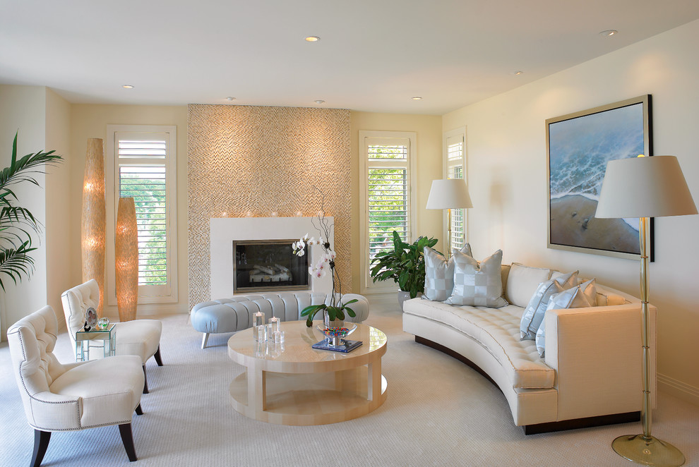 Design ideas for a contemporary formal living room in Cleveland with beige walls, carpet and a standard fireplace.