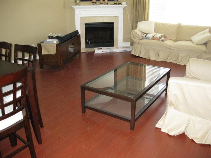 Inspiration for a timeless medium tone wood floor living room remodel in Jacksonville