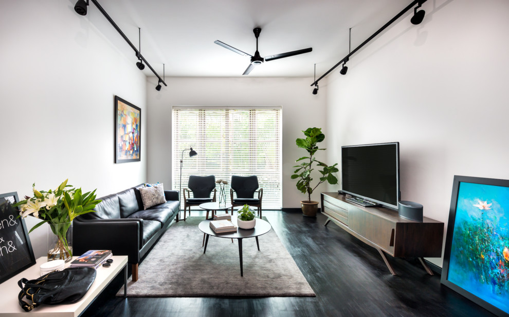 Inspiration for a scandinavian dark wood floor living room remodel in Singapore with white walls, no fireplace and a tv stand