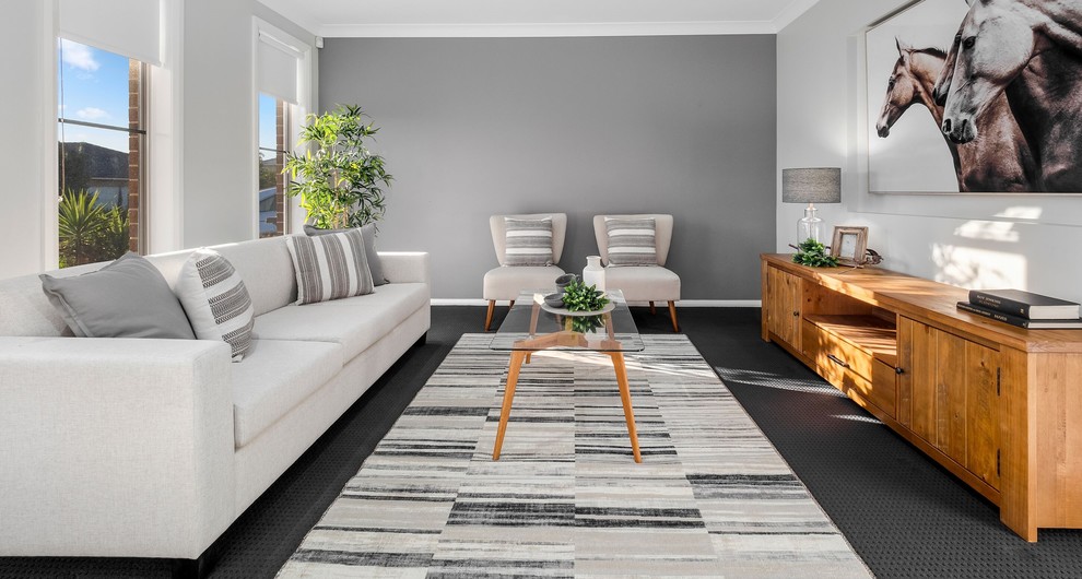Design ideas for a medium sized classic enclosed living room in Sydney with grey walls, carpet, a freestanding tv and grey floors.