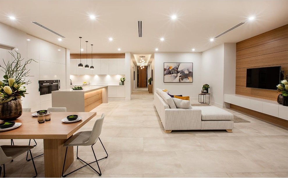 Large modern formal open plan living room in Adelaide with white walls, porcelain flooring and a wall mounted tv.