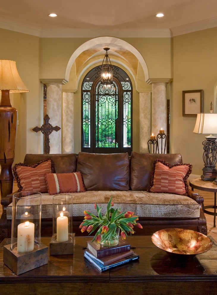 This is an example of a mediterranean living room in Austin with beige walls.