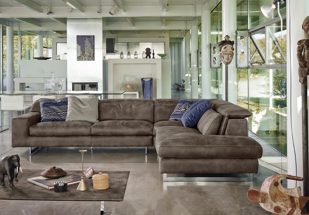 Example of a trendy formal and open concept concrete floor living room design in Other with no tv