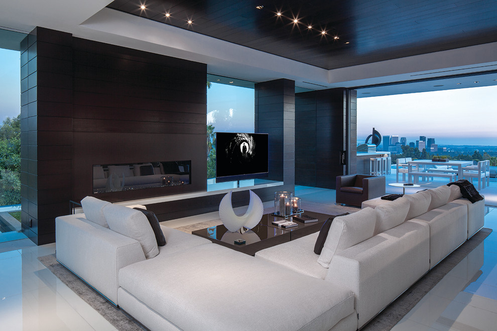 This is an example of a contemporary formal open plan living room in Los Angeles with a ribbon fireplace and a freestanding tv.