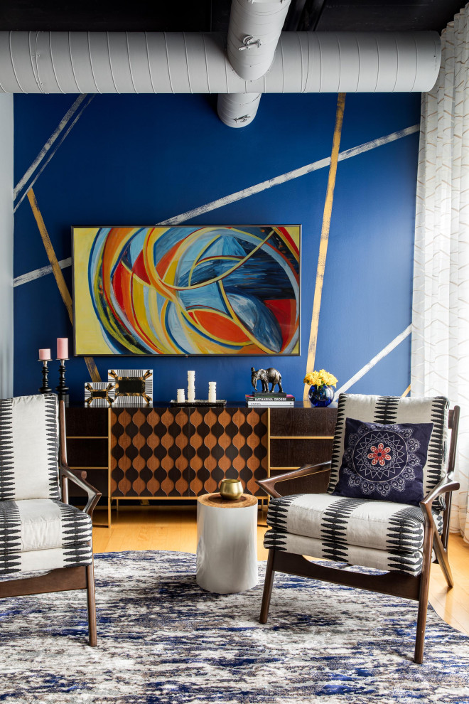 This is an example of a medium sized eclectic formal open plan living room in Boston with medium hardwood flooring, no fireplace, no tv, blue walls, beige floors and exposed beams.