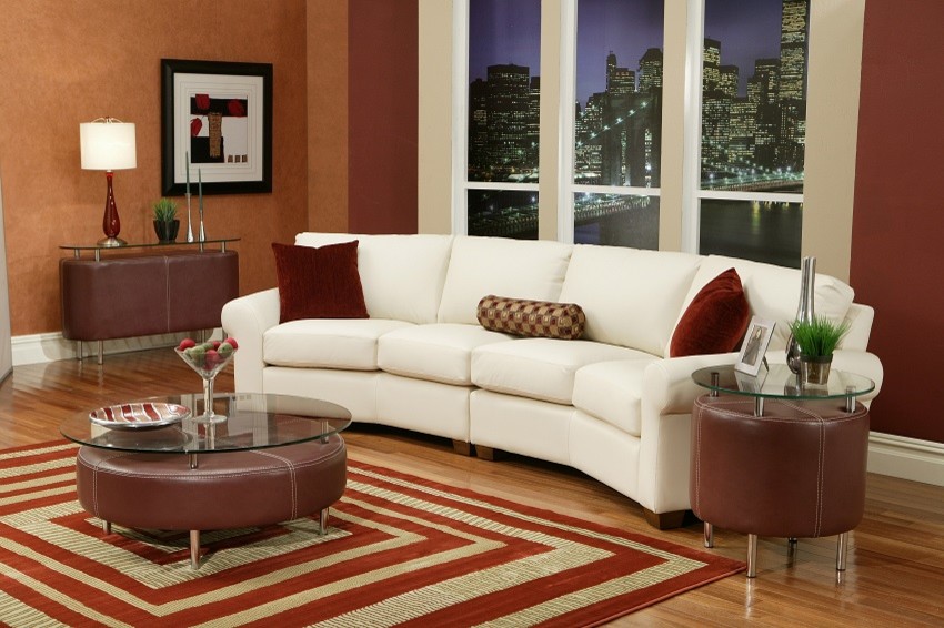 Photo of a large classic living room in Atlanta with red walls and light hardwood flooring.