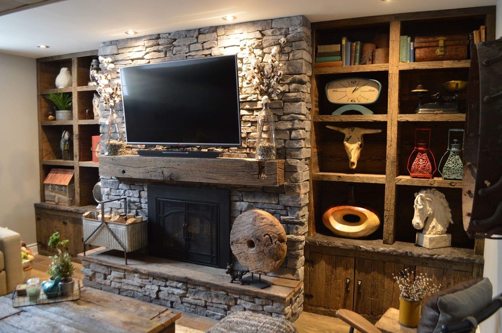 Inspiration for a mid-sized rustic living room library remodel in Ottawa with gray walls, a standard fireplace, a concrete fireplace and a wall-mounted tv