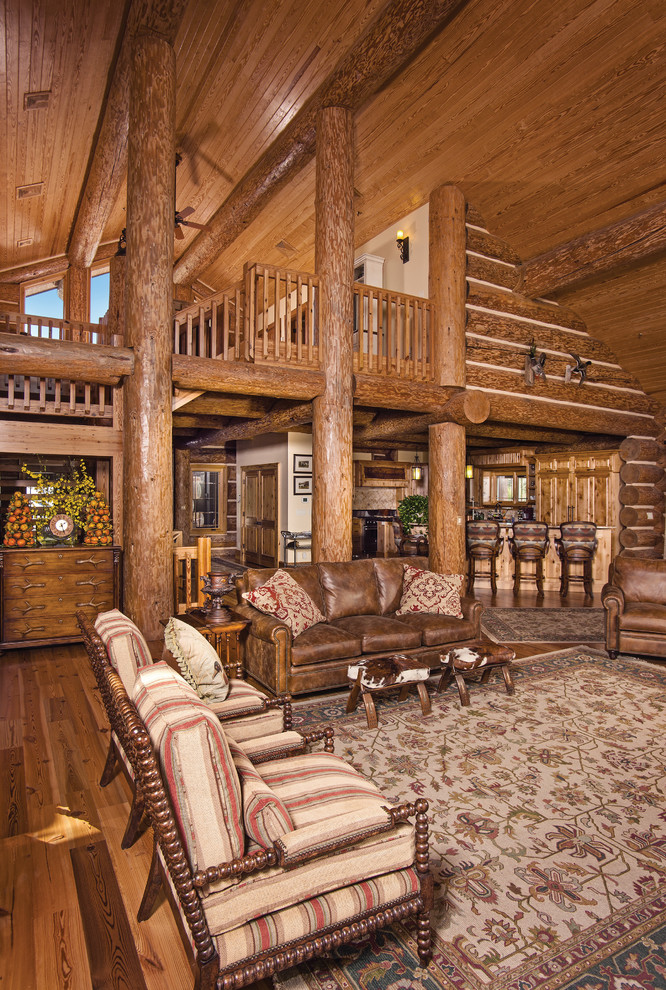 Large rustic mezzanine living room in Charlotte with medium hardwood flooring.