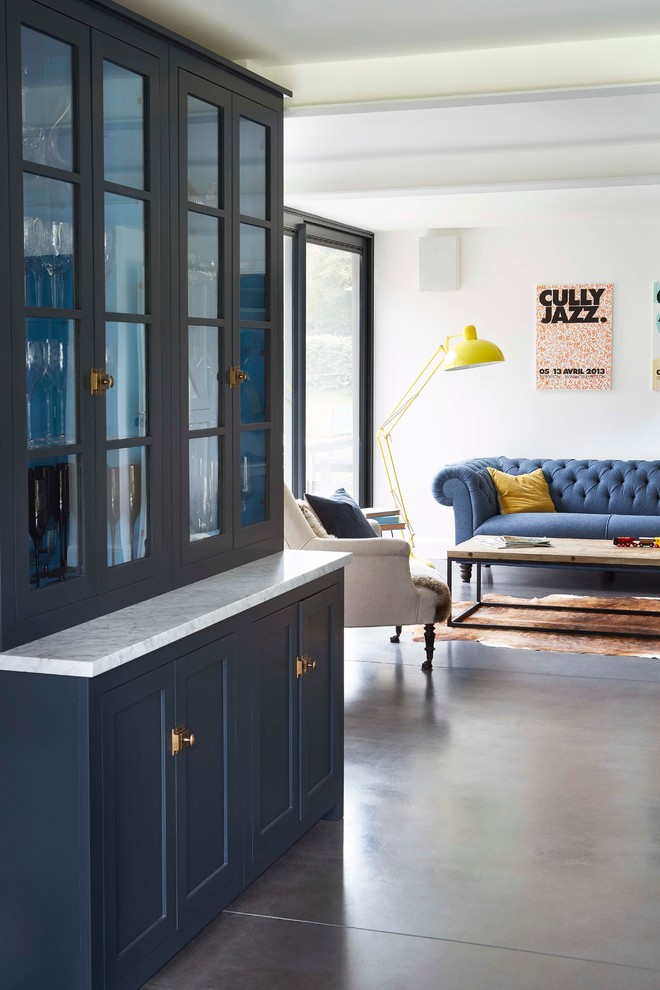 Traditional living room in London with grey floors.