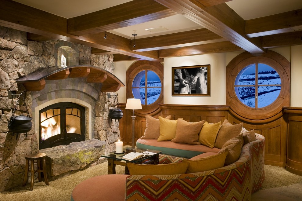 Rustic formal enclosed living room in Denver with carpet, a standard fireplace, a stone fireplace surround, white walls and no tv.