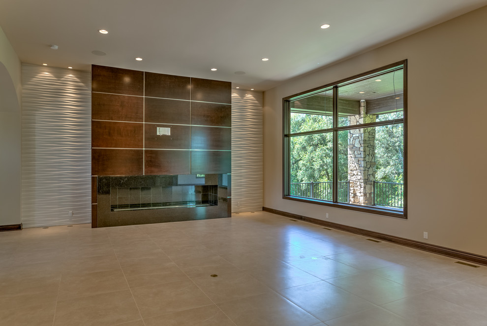 This is an example of an expansive contemporary open plan living room in Omaha with beige walls, porcelain flooring, a ribbon fireplace, a wooden fireplace surround and a wall mounted tv.
