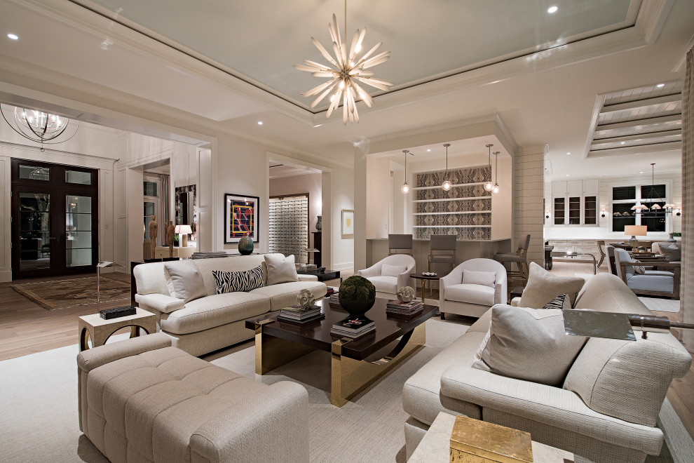 This is an example of a contemporary open plan living room in Miami with white walls, medium hardwood flooring, brown floors and a drop ceiling.