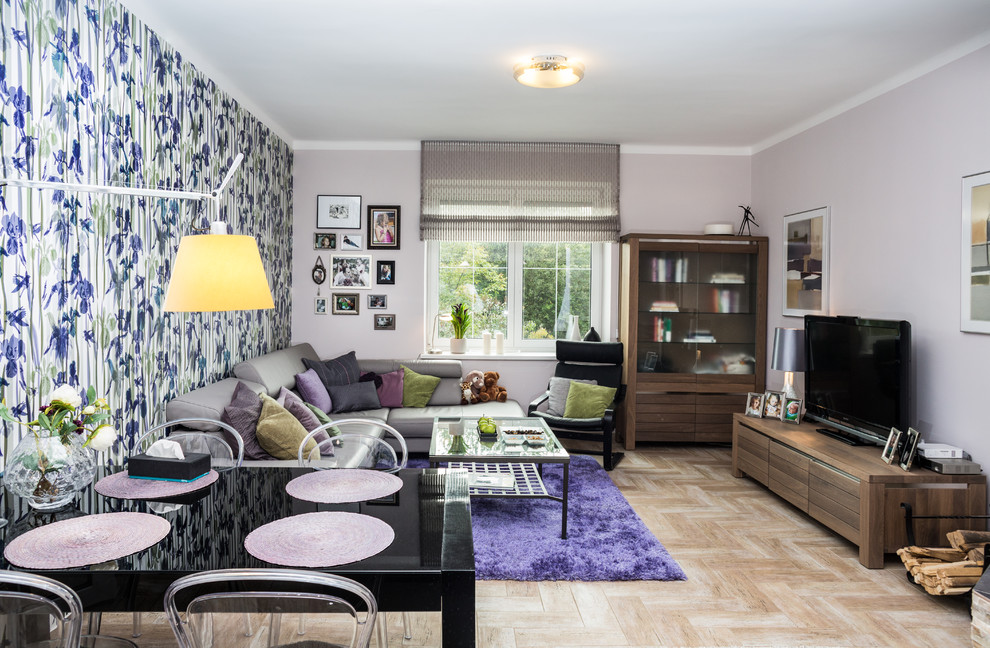 Medium sized eclectic grey and purple living room in Other with a freestanding tv.
