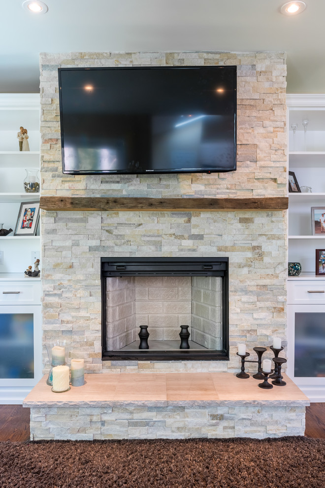 Mid-sized trendy open concept carpeted living room photo in Ottawa with a music area, white walls, a standard fireplace, a brick fireplace and a wall-mounted tv