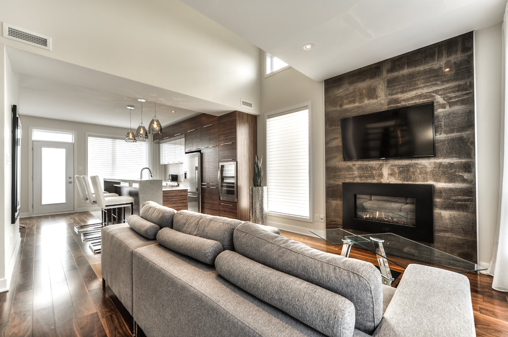 Mid-sized trendy open concept living room photo in Montreal with a stone fireplace, a wall-mounted tv and a ribbon fireplace
