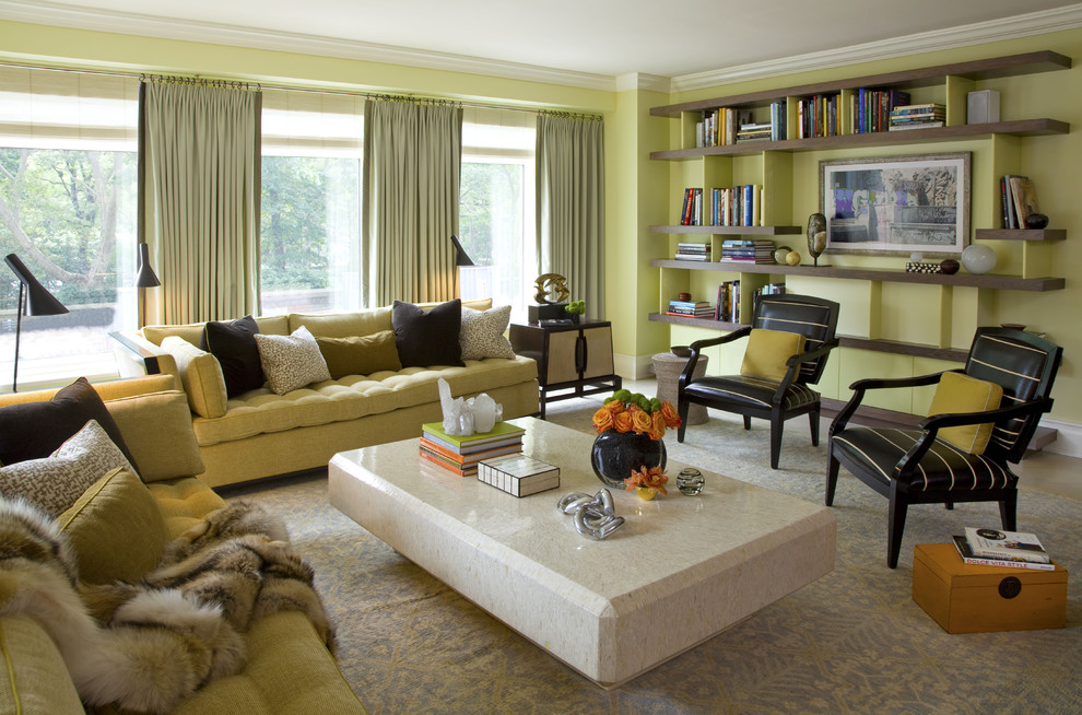 This is an example of a medium sized contemporary enclosed living room in Chicago with green walls and carpet.