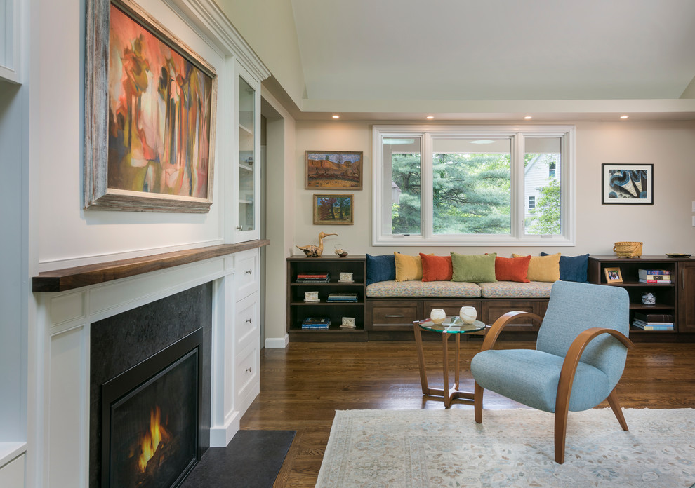 Traditional formal open plan living room in Boston with beige walls, dark hardwood flooring, a standard fireplace, a freestanding tv and brown floors.