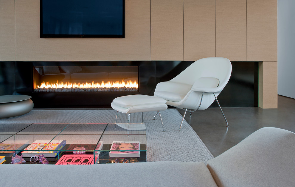Minimalist open concept concrete floor living room photo in Phoenix with a ribbon fireplace and a wall-mounted tv