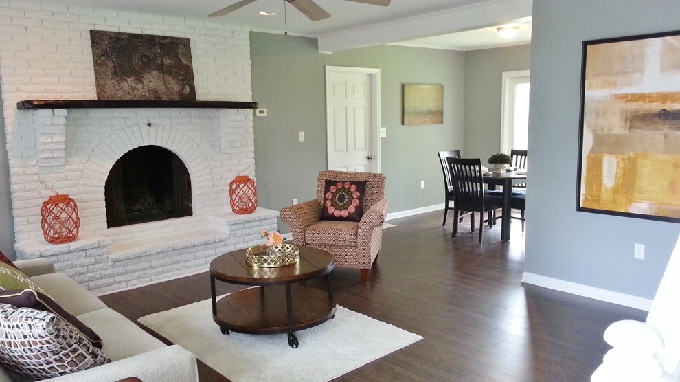 Photo of a small classic living room in Philadelphia with grey walls, dark hardwood flooring, a standard fireplace and a brick fireplace surround.
