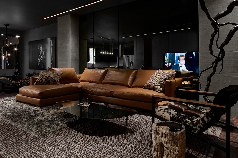 Пример оригинального дизайна: открытая гостиная комната среднего размера в стиле модернизм с серыми стенами, паркетным полом среднего тона, телевизором на стене и коричневым полом без камина