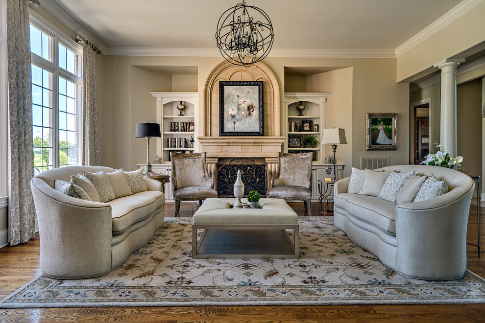 Inspiration for a medium sized traditional formal open plan living room in Nashville with beige walls, dark hardwood flooring, a standard fireplace, a stone fireplace surround and no tv.