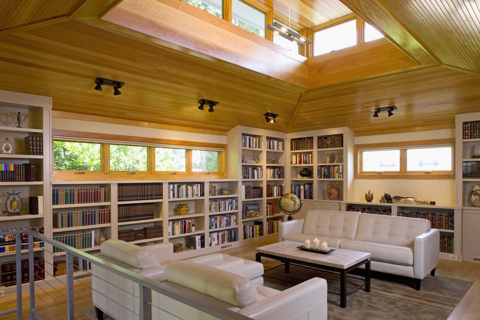 Foto di un soggiorno minimal con libreria