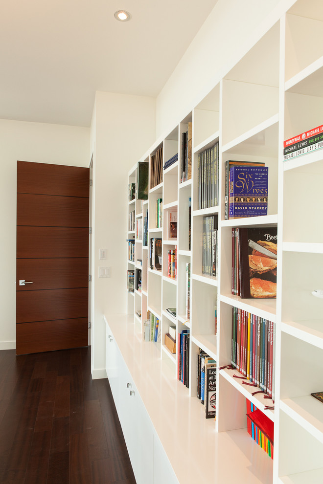 Minimalist living room library photo in Edmonton with white walls