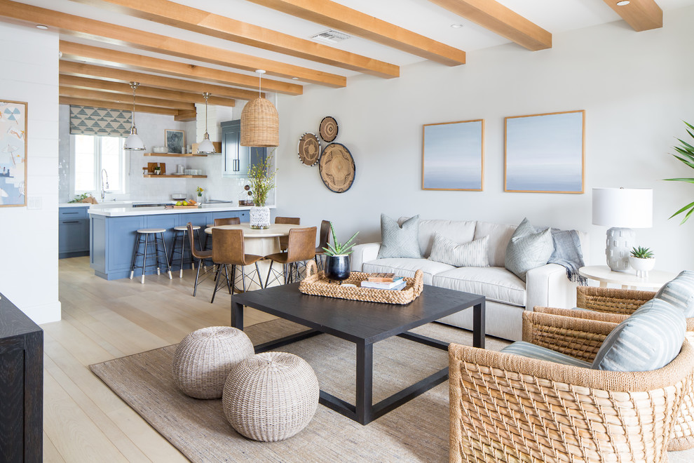 Beach style living room in Orange County with feature lighting.