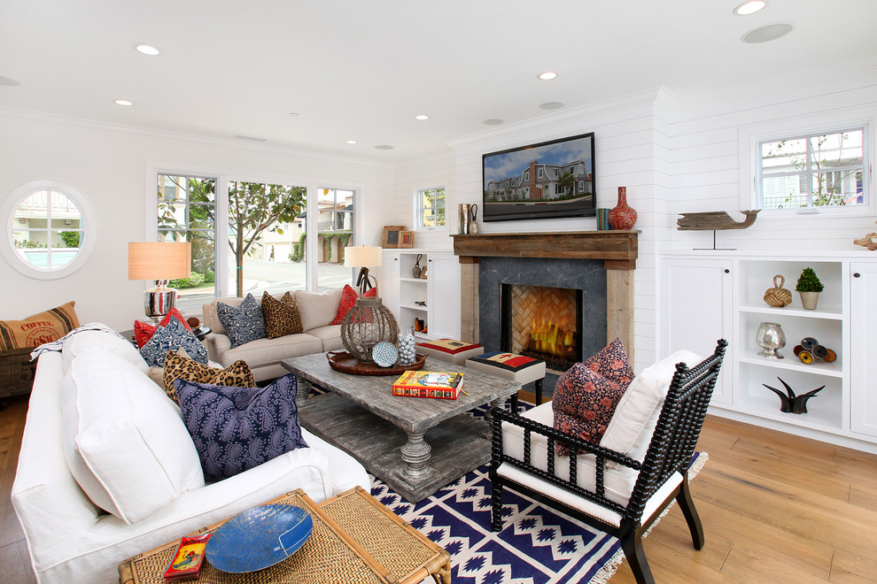 Design ideas for a large coastal living room in Orange County with white walls.