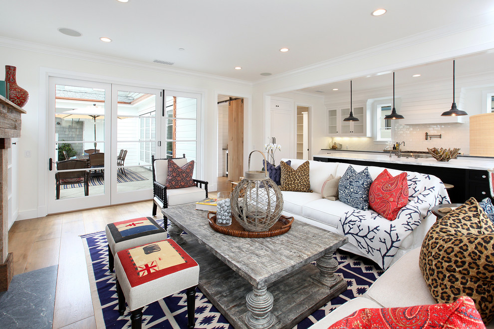 Example of a large beach style open concept living room design in Orange County