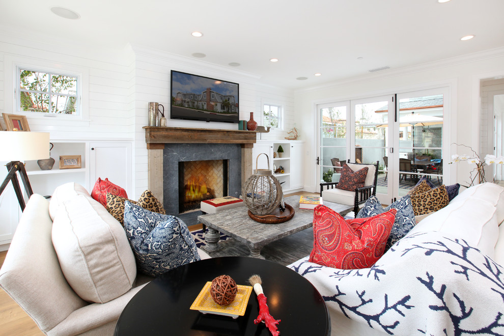 Traditional living room in Orange County with white walls and a standard fireplace.